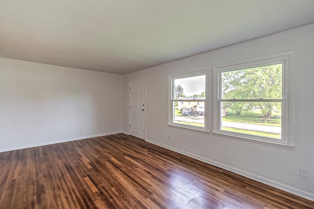 114 Cave Springs Dr, Lancaster, KY 40444 - unfurnished room featuring baseboards and dark wood-type flooring