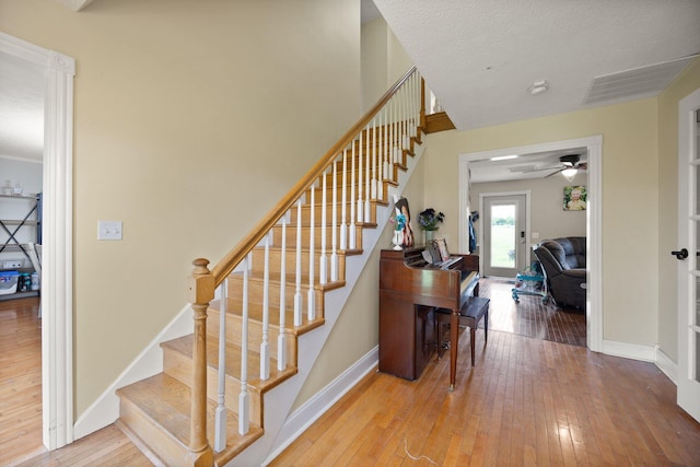 500 Curdsville Rd, Harrodsburg, KY 40330 - stairway with ceiling fan, hardwood / wood-style flooring, baseboards, and visible vents
