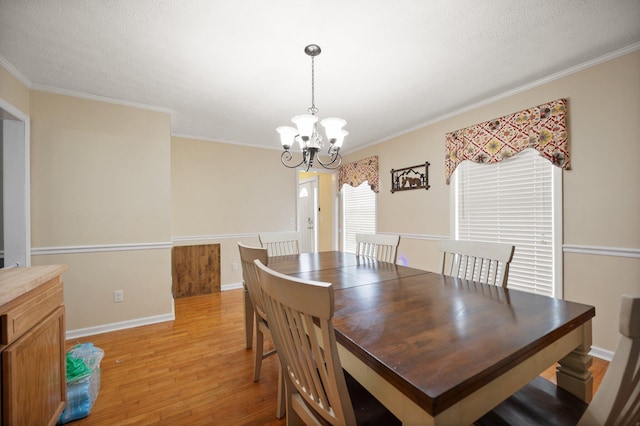500 Curdsville Rd, Harrodsburg, KY 40330 - dining area with an inviting chandelier, light wood-style flooring, a textured ceiling, and ornamental molding