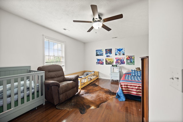 500 Curdsville Rd, Harrodsburg, KY 40330 - bedroom featuring hardwood / wood-style flooring, a textured ceiling, a ceiling fan, and visible vents