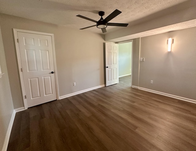 1072 Jenny Lilllard Rd, Lawrenceburg, KY 40342 - unfurnished bedroom featuring baseboards, a textured ceiling, and dark wood finished floors