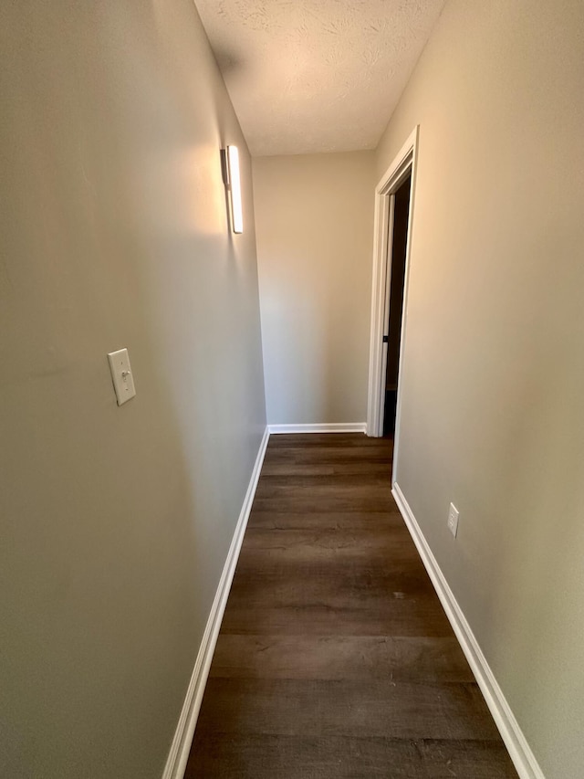 1072 Jenny Lilllard Rd, Lawrenceburg, KY 40342 - corridor with a textured ceiling, baseboards, and dark wood-type flooring