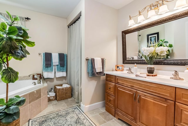 bathroom featuring a sink, double vanity, baseboards, and a bath