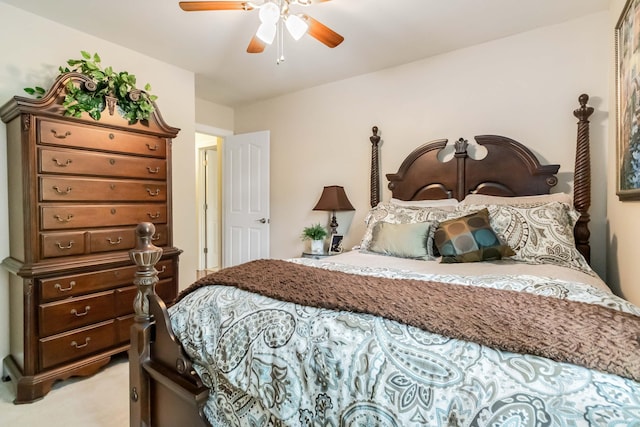 bedroom featuring light carpet and ceiling fan