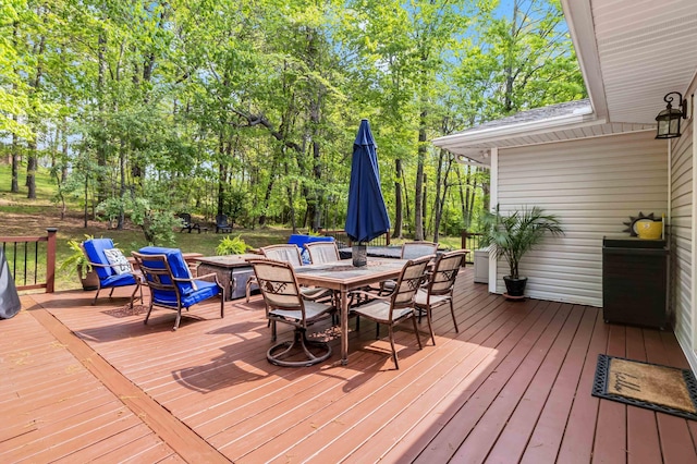 deck featuring outdoor dining area