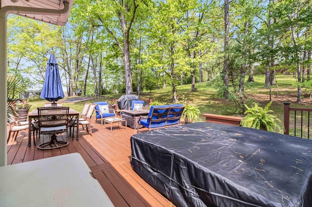 deck with a fire pit and outdoor dining space