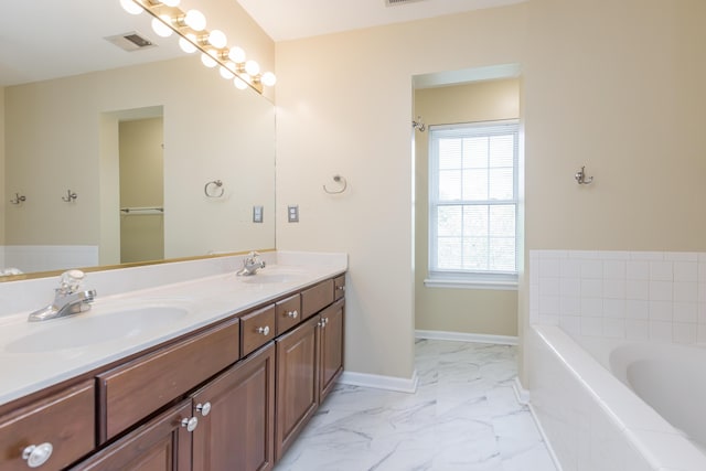 full bathroom with visible vents, a sink, marble finish floor, and a bath