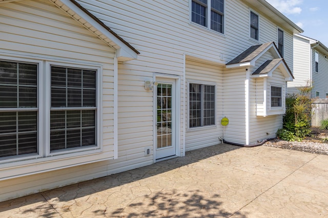 rear view of property featuring a patio area