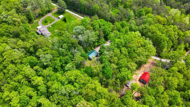 birds eye view of property with a wooded view