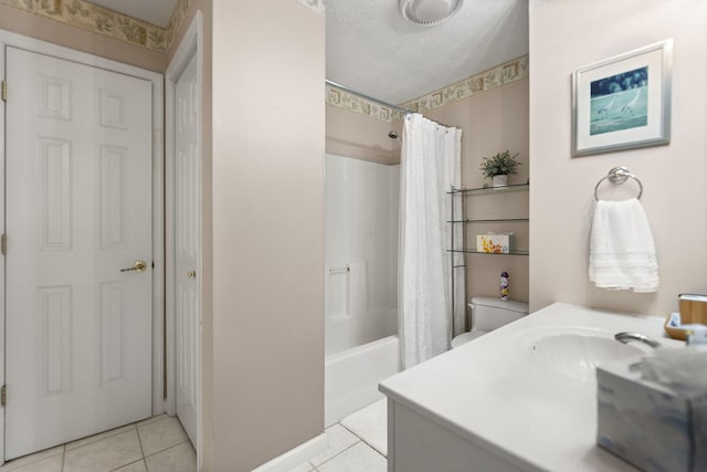bathroom with a textured ceiling, shower / bath combination with curtain, tile patterned floors, baseboards, and vanity