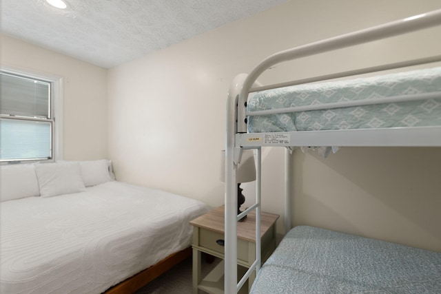 bedroom featuring a textured ceiling