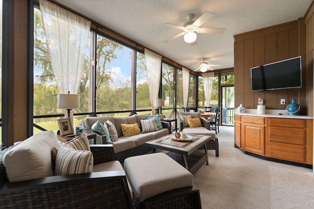 sunroom / solarium featuring carpet flooring and expansive windows