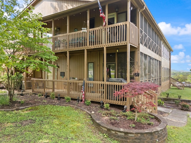 rear view of property with a deck