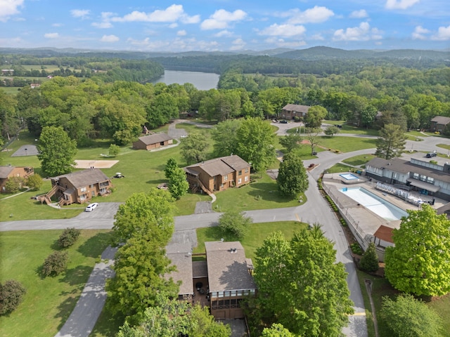 bird's eye view featuring a water view and a wooded view