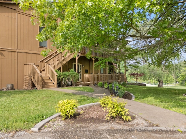 view of yard featuring stairs and a wooden deck