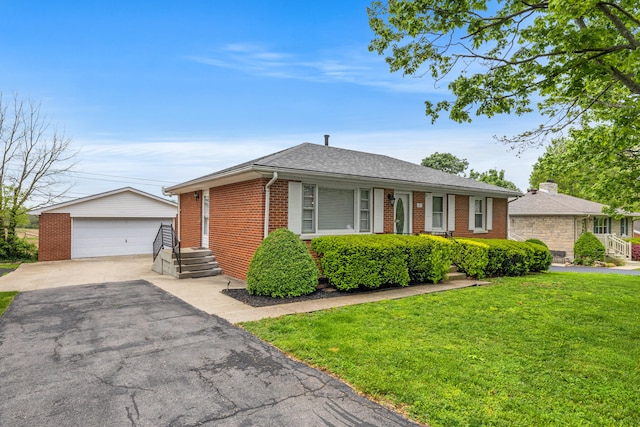 107 Highview Dr, Midway, KY 40347 - view of front of house featuring roof with shingles, brick siding, a detached garage, a front yard, and an outbuilding