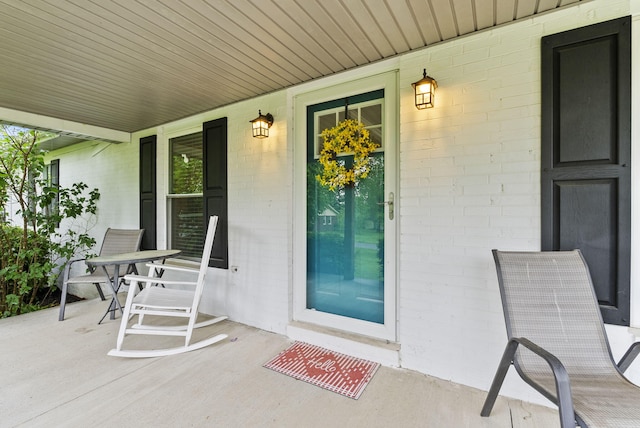 220 Garden Ave, Stanford, KY 40484 - view of exterior entry with a porch and brick siding