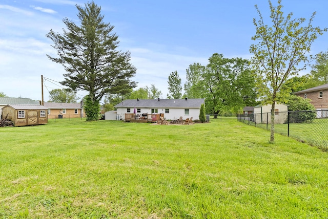 220 Garden Ave, Stanford, KY 40484 - view of yard featuring a fenced backyard, an outbuilding, a storage shed, and a deck