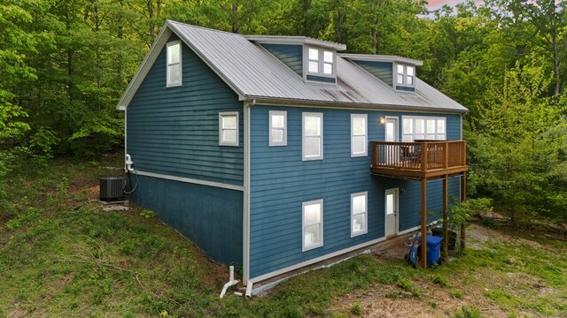 7314 Blue Level Rd, Rockfield, KY 42274 - view of property exterior with a view of trees, central AC, metal roof, and a balcony