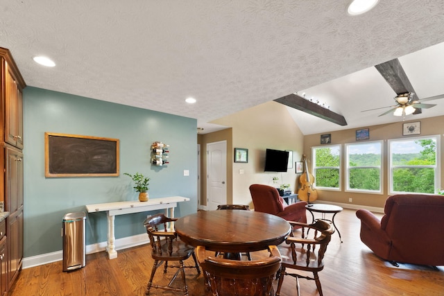 7314 Blue Level Rd, Rockfield, KY 42274 - dining area featuring a textured ceiling, ceiling fan, baseboards, and light wood-type flooring