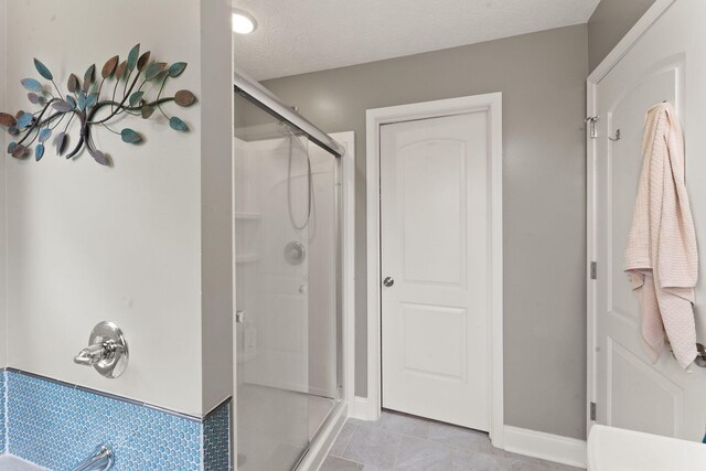 7314 Blue Level Rd, Rockfield, KY 42274 - bathroom with baseboards, a textured ceiling, and a shower stall