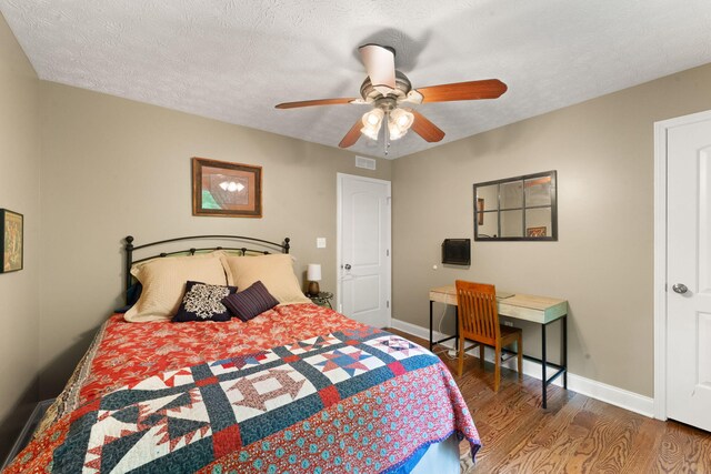 7314 Blue Level Rd, Rockfield, KY 42274 - bedroom with baseboards, a ceiling fan, wood finished floors, and visible vents