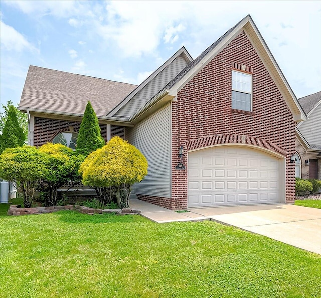 1148 Oatlands Park, Lexington, KY 40509 - view of front of home featuring brick siding, a garage, a front yard, and concrete driveway