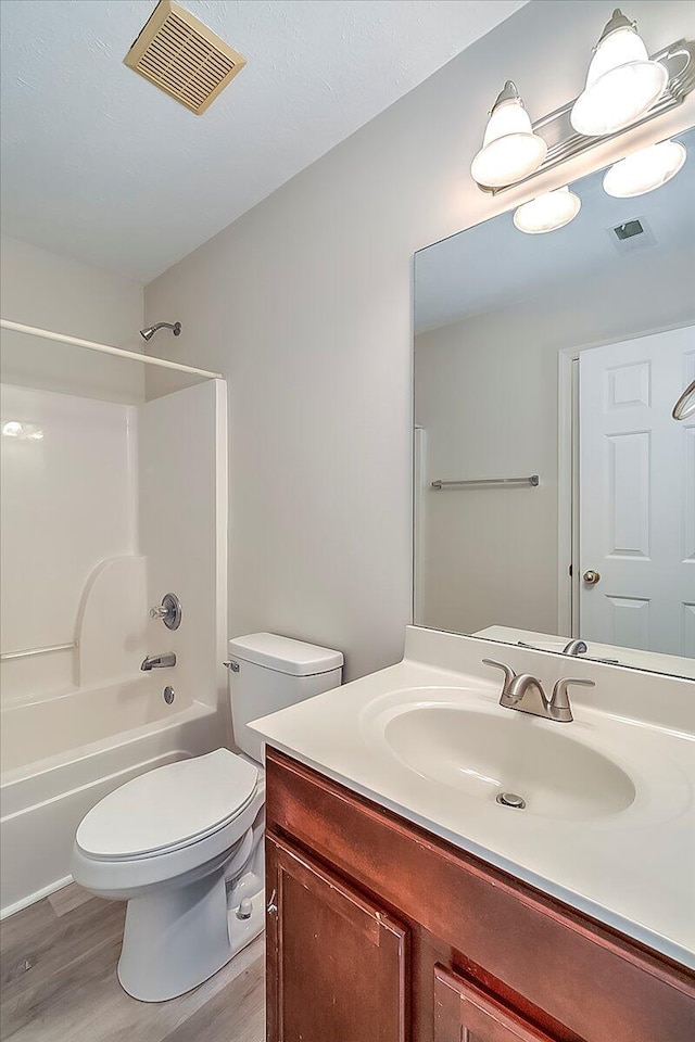 1148 Oatlands Park, Lexington, KY 40509 - full bath featuring shower / bath combination, visible vents, wood finished floors, and vanity