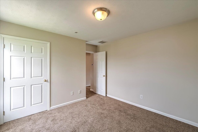 1148 Oatlands Park, Lexington, KY 40509 - unfurnished bedroom with baseboards, carpet flooring, and visible vents