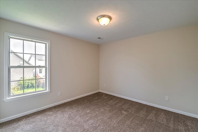 1148 Oatlands Park, Lexington, KY 40509 - spare room featuring baseboards and dark colored carpet
