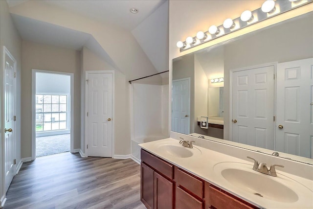 1148 Oatlands Park, Lexington, KY 40509 - full bathroom featuring double vanity, a sink, baseboards, and wood finished floors