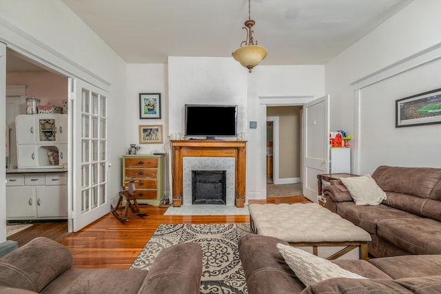 363 S Main St, Winchester, KY 40391 - living room with a tiled fireplace and wood finished floors