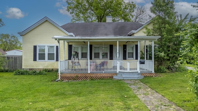 363 S Main St, Winchester, KY 40391 - view of front of home with covered porch, fence, a front lawn, and a chimney