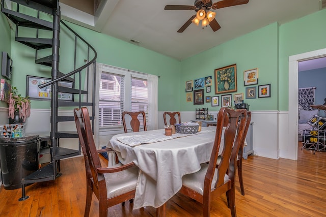 363 S Main St, Winchester, KY 40391 - dining area with visible vents, wood finished floors, wainscoting, and ceiling fan