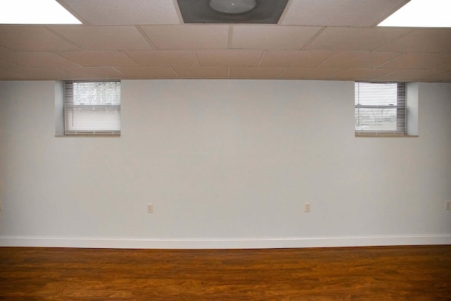 below grade area with baseboards and wood finished floors