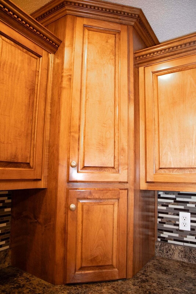 room details featuring wooden walls and ornamental molding