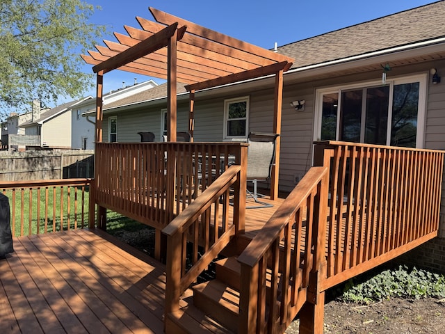 wooden terrace featuring fence and a pergola