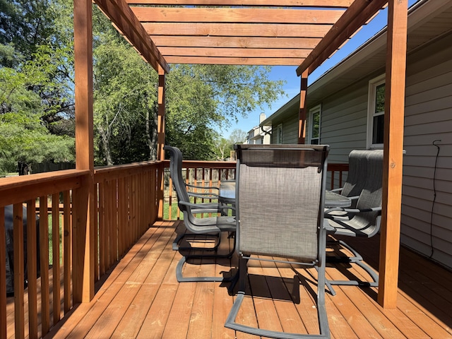 deck featuring a pergola and outdoor dining area
