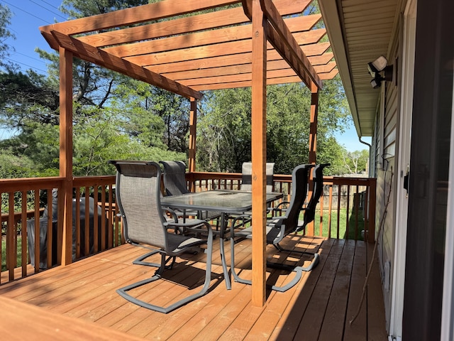 wooden deck with outdoor dining area and a pergola