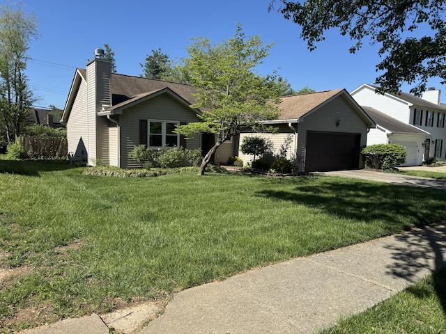 ranch-style home with a garage, a front lawn, a chimney, and a shingled roof