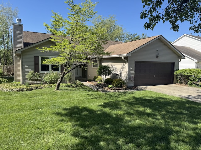 ranch-style house featuring roof with shingles, an attached garage, a front yard, a chimney, and driveway