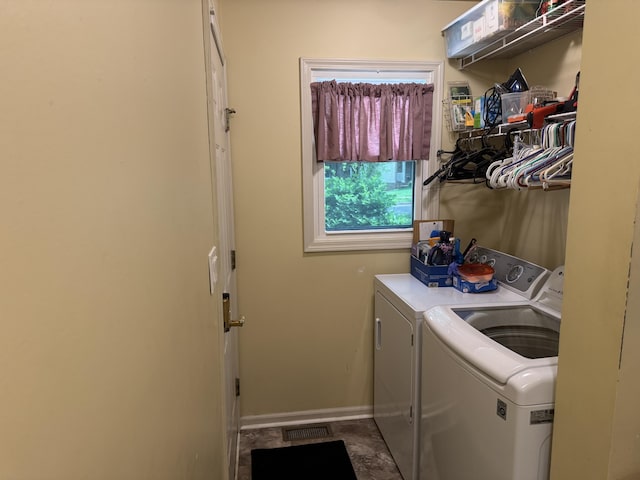 laundry room with laundry area, baseboards, washer and dryer, and visible vents