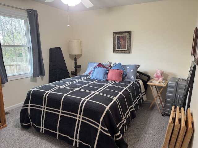 bedroom with carpet floors, baseboards, and ceiling fan