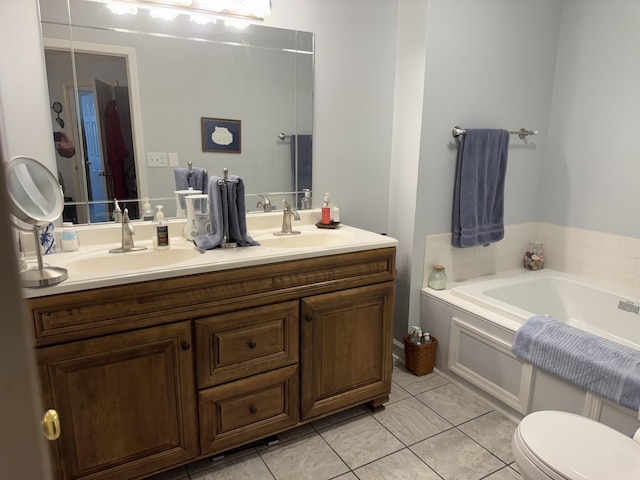 full bath featuring double vanity, a bath, tile patterned flooring, a sink, and toilet