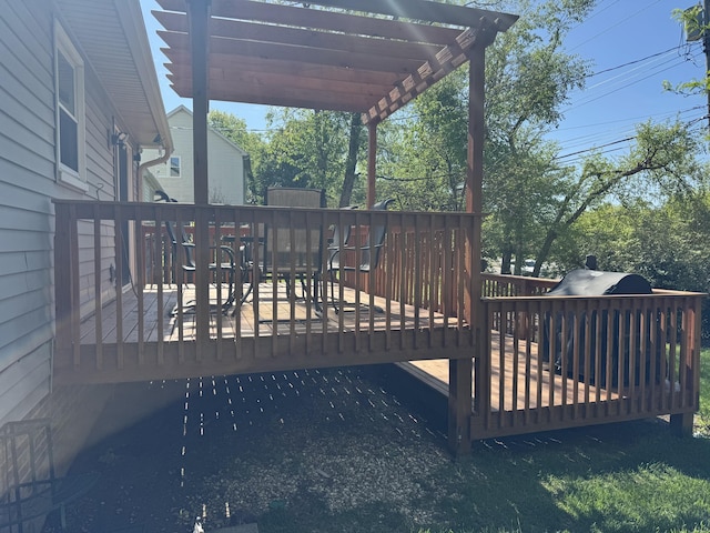 wooden deck featuring outdoor dining area and a pergola