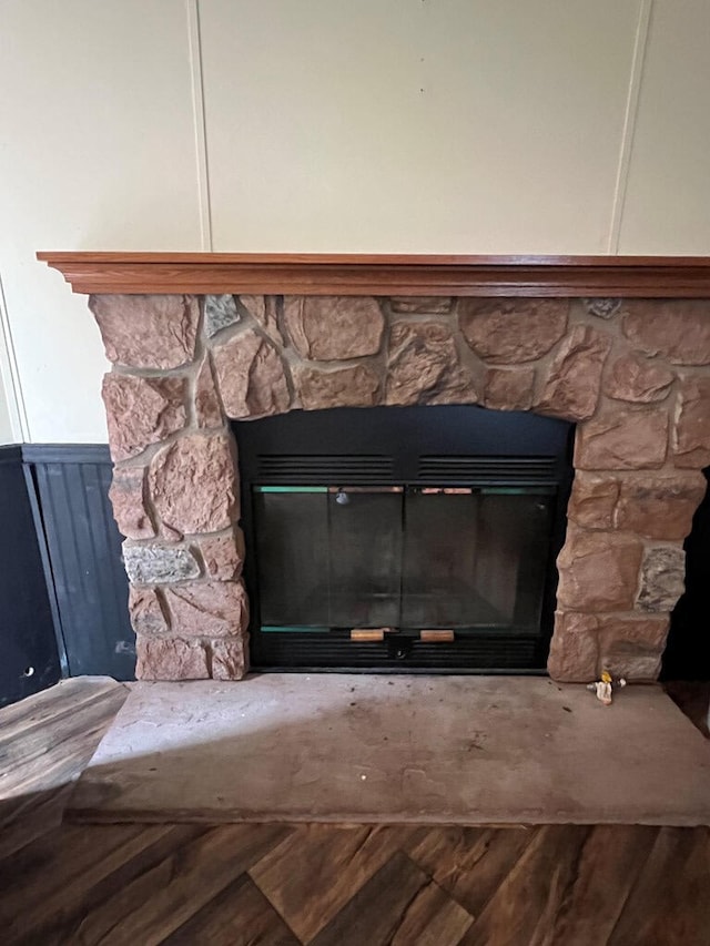 details with a stone fireplace