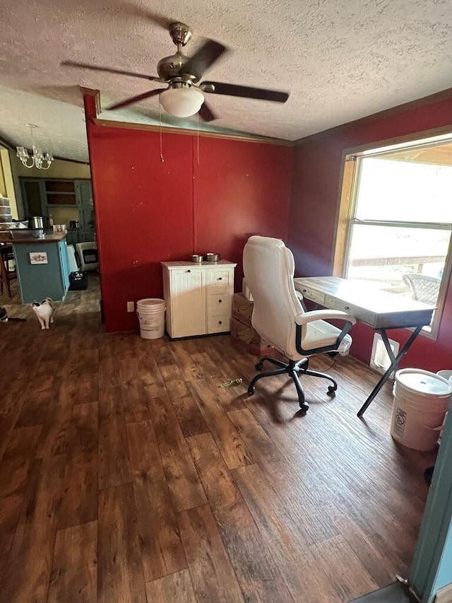 home office featuring wood-type flooring, a textured ceiling, and ceiling fan with notable chandelier