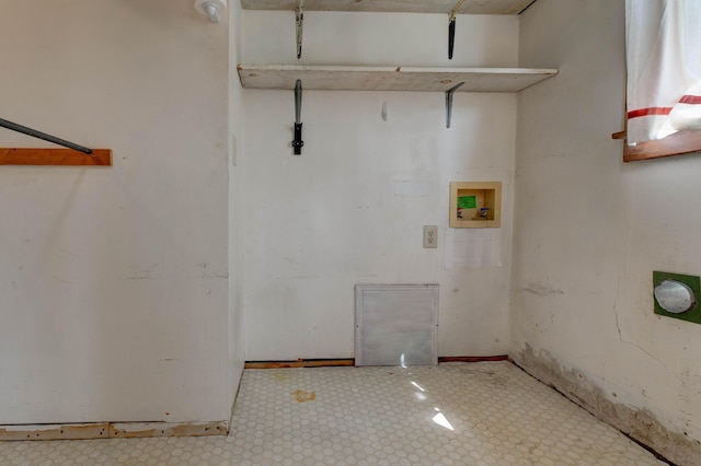 clothes washing area featuring laundry area, washer hookup, and tile patterned floors