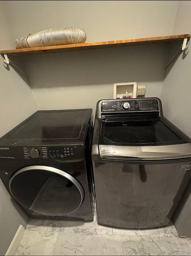 187 Sinnette, Greenup, KY 41144 - laundry room featuring separate washer and dryer, laundry area, and marble finish floor