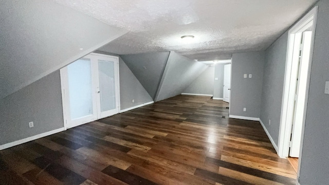 187 Sinnette, Greenup, KY 41144 - bonus room with baseboards, a textured ceiling, lofted ceiling, and wood finished floors